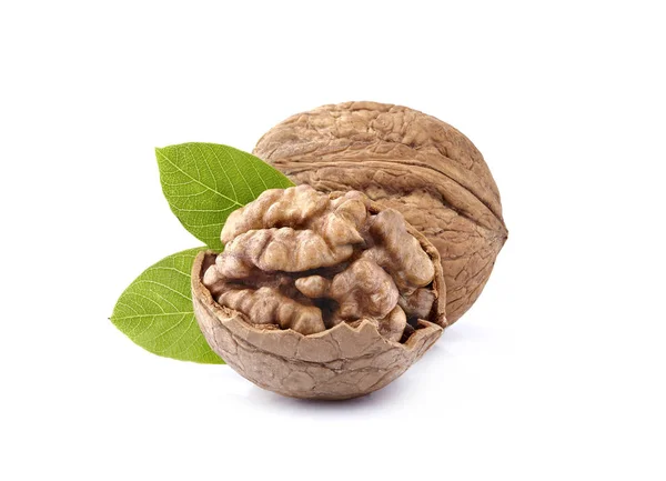 Walnuts in closeup with leaves on white background — Stock Photo, Image