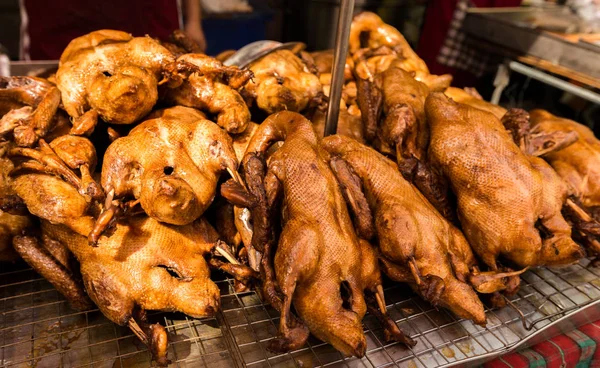 Roasted duck in a showcase in front of store.