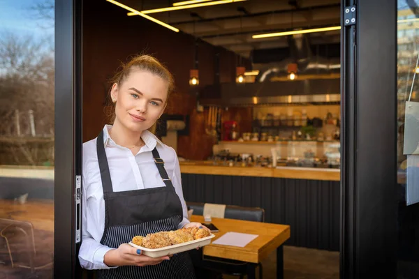 Portrait Smiling Owner Standing Restaurant Door Holding Baked Meatballs Young — Stock Photo, Image