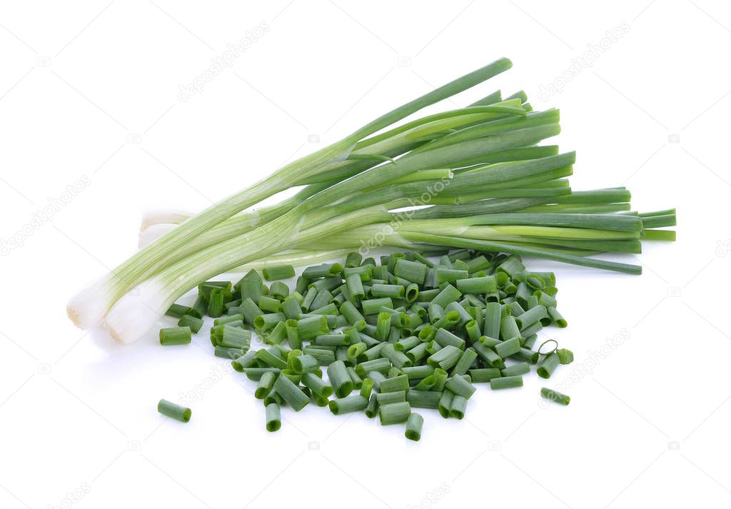 Onion leaves on white background