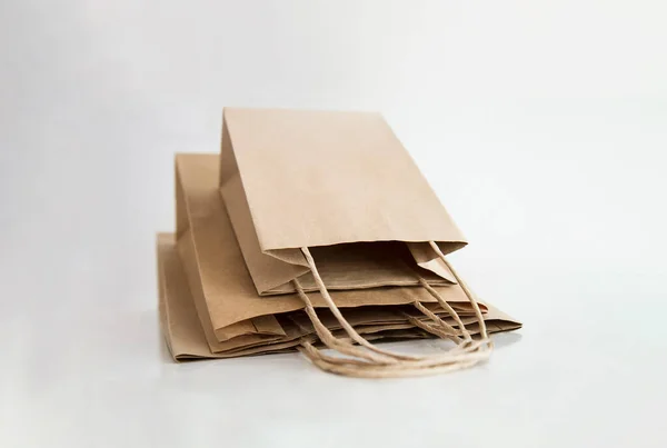 Kraft paper bags isolated on white background. Shopping bag mockup