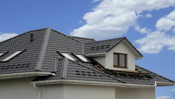 Metal roof tiles, Corrugated metal roof and metal roofing, Black metal roof tiles on the roof