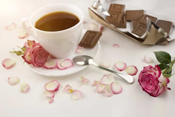 Coffee rose and chocolate on a white background