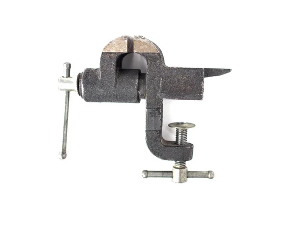 Small black desktop vise, close-up, isolate, scavenger's daughter