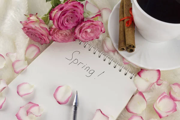 Spring notebook, cup of coffee, roses cinnamon — Stock Photo, Image