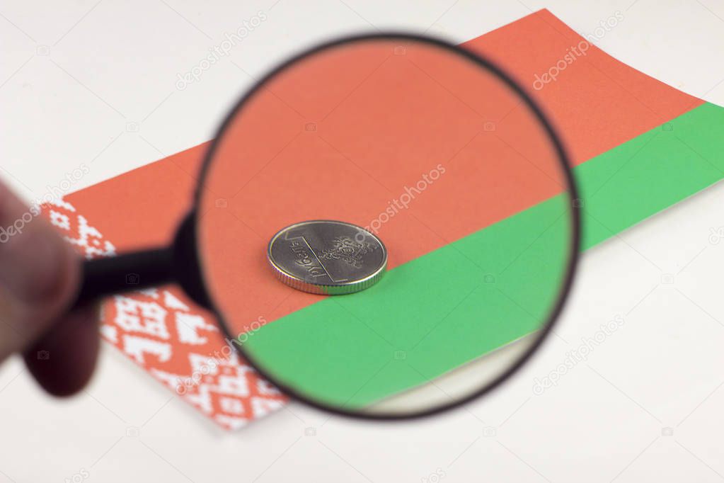 Belorussian money with magnifying glass, the Belarusian flag