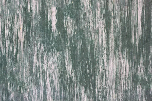 Текстура зеленой и белой краски на железной поверхности — стоковое фото