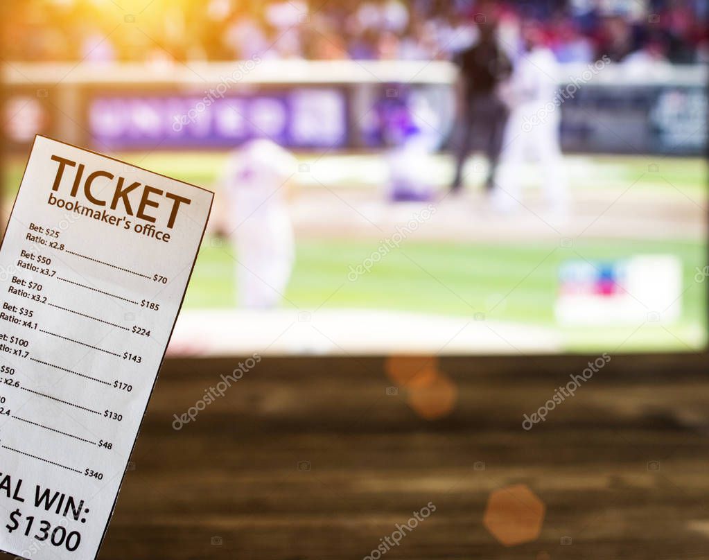Bookmaker ticket on the background of a TV showing baseball, sports betting, bookmaker