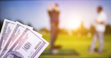 Money dollars against the backdrop of a TV showing golf, sports betting, money dollars clipart