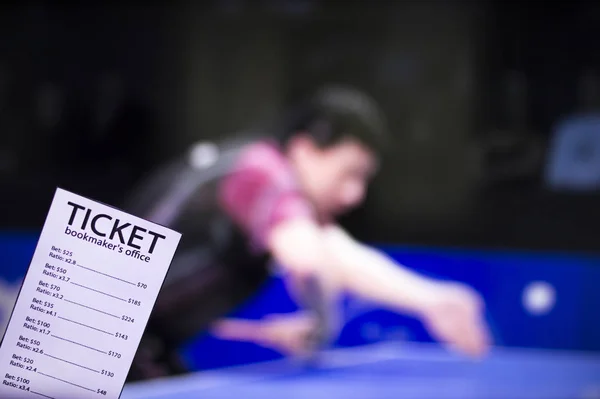 Bookmaker ticket on the background of the TV, which shows table tennis, sports betting, bookmaker ticket, ping-pong