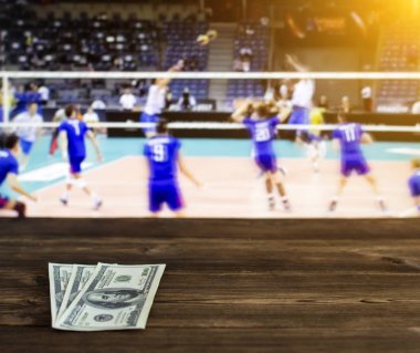 Money dollars on the background of a TV on which show volleyball, sports betting, dollars clipart