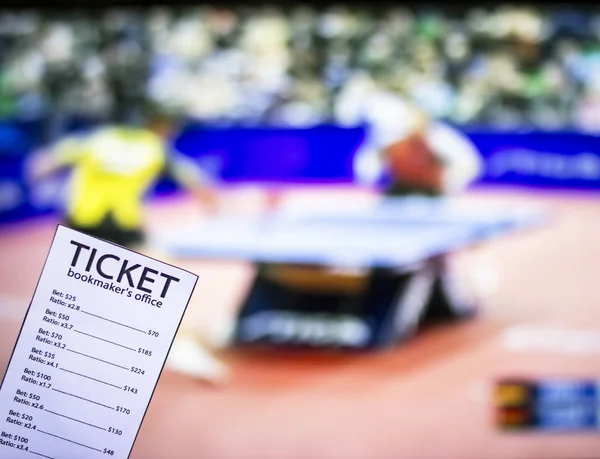 Bookmaker ticket on the background of the TV, which shows table tennis, sports betting, bookmaker ticket, ping-pong