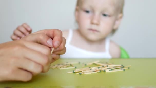 Mother Lights Matches Teaches Little Child Children Cannot Take Matches — Stock Video