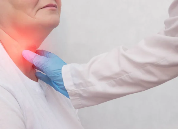 Adult woman on reception at the doctor who has problems with the thyroid gland and the endcrine system, close-up, patient — Stock Photo, Image