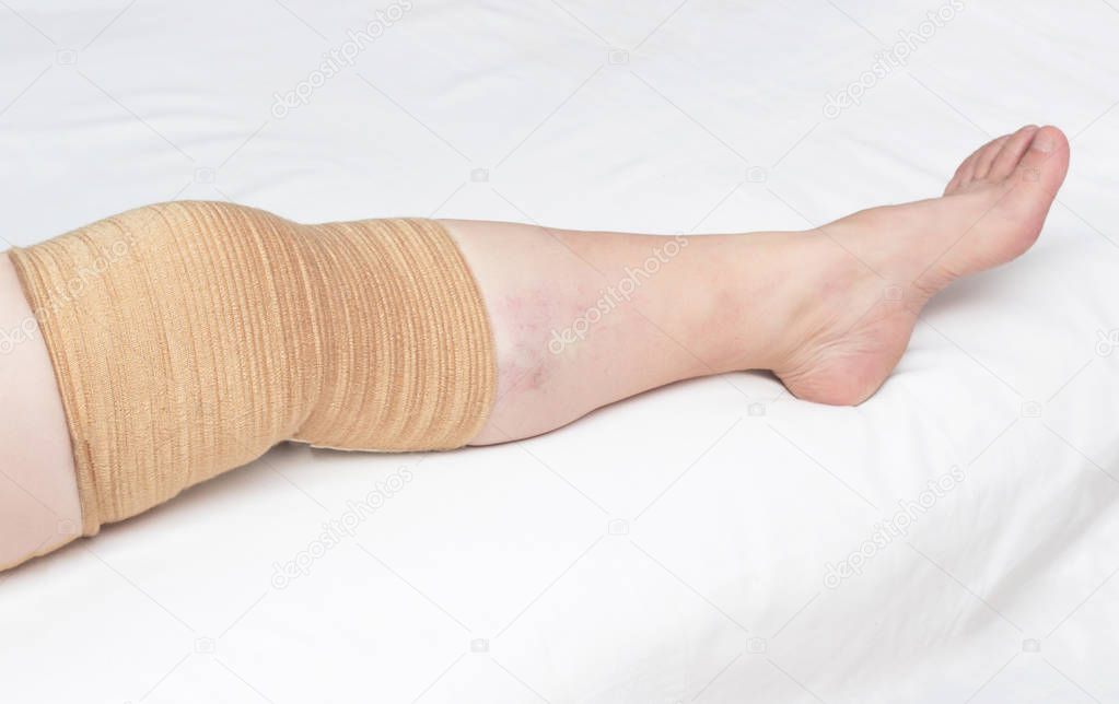Medical kneecap for fixing the sore knee from osteoarthritis and other diseases, close-up, copy space