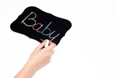 El tebeşir bir tablet kelime çocuk evlat edinme kavramı ve bir çocuk, infertilite, yakın çekim, kopya alanı hayalleri yazıyor.