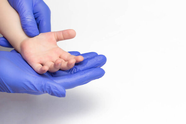 Children's hand in the hands of a pediatrician pediatric doctor concept of pediatric medicine, health and insurance, copy space, psychotherapy