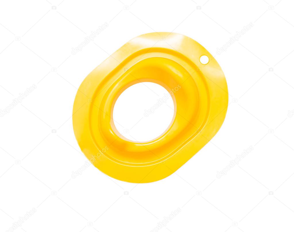 Yellow childrens pad on the toilet, child toilet training, isolate