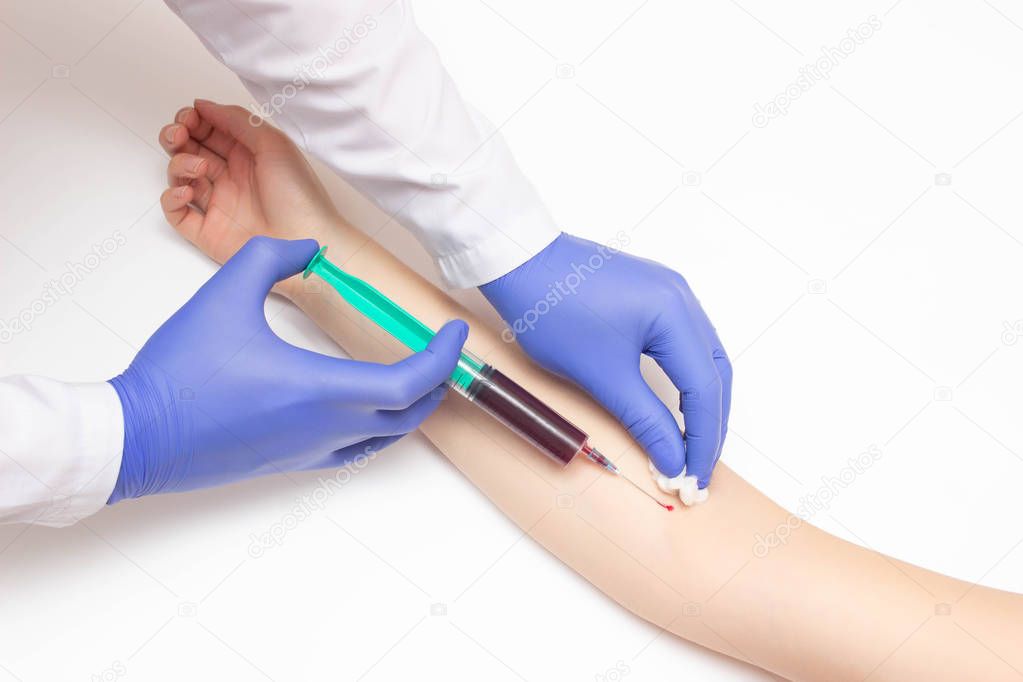 The doctor takes a blood test from a vein for cancer and sexually transmitted infections, the ifa method, pregnancy and Coagulogram