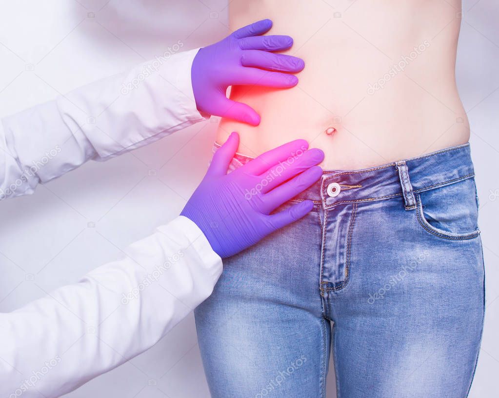 The doctor conducts a visual inspection and palpation of the patient s abdomen on suspicion of acute apendicitis and inflammation, abdominal pain, medical