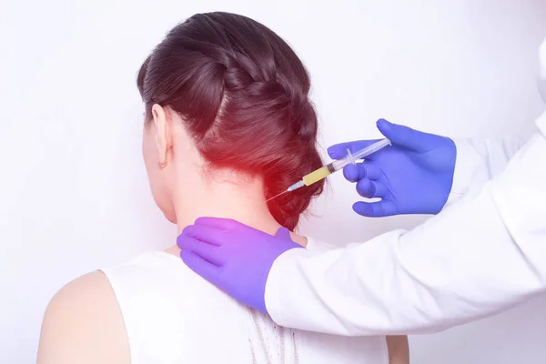 Doctor injects plasma therapy into the girl\'s neck to relieve pain from intervertebral hernia and fibromyalgia, inflammation, discomfort