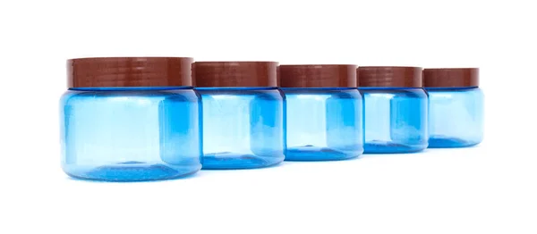 Blue plastic jars on a white background isolate, polyethylene terephthalate, tara — Stock Photo, Image