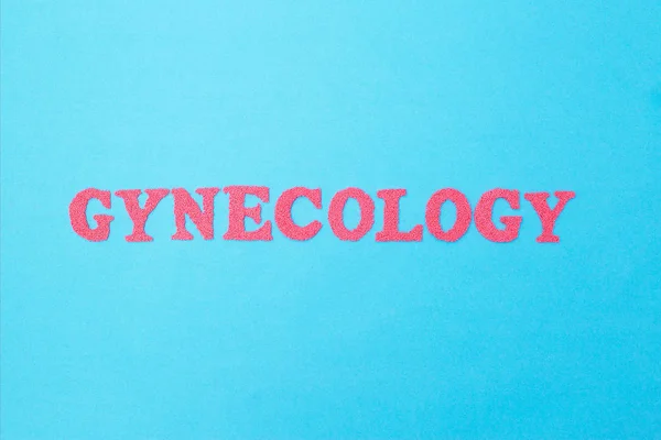 Gynecology inscription in red letters on a blue background. The — Stock Photo, Image