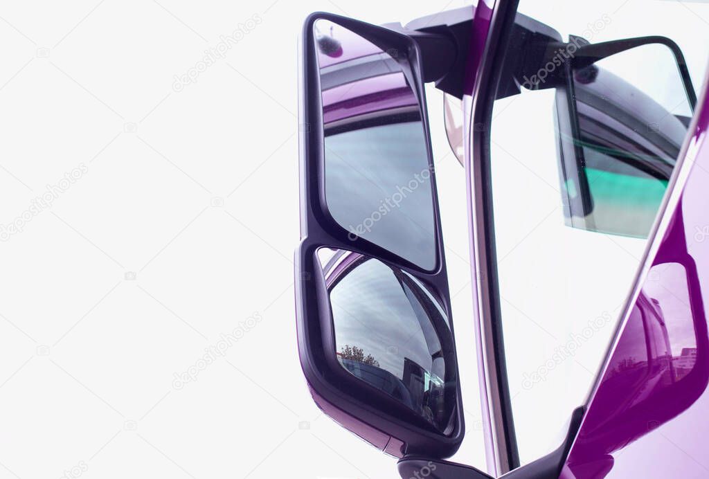 Side rearview mirror of a truck. The concept of a review of driver visibility and safety, copy space