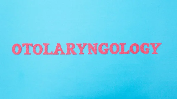 The word otolaryngology on a blue background. Concept is a section of medicine dealing with the treatment of the ear, throat and nose. ENT doctor — Stock Photo, Image