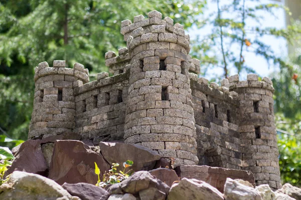 Garden decor with stones in the form of a castle