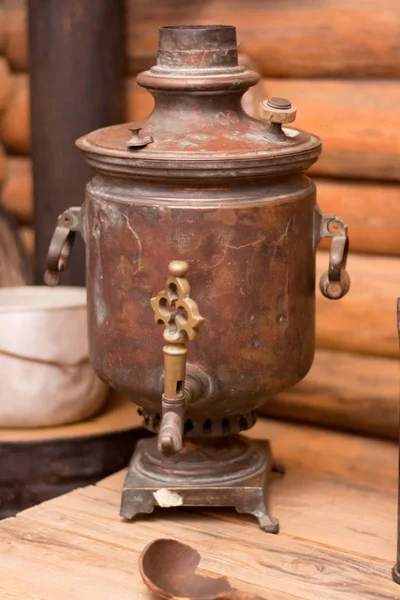 old russian samovar on wooden background