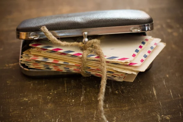 Old family letters in a retro hand bag