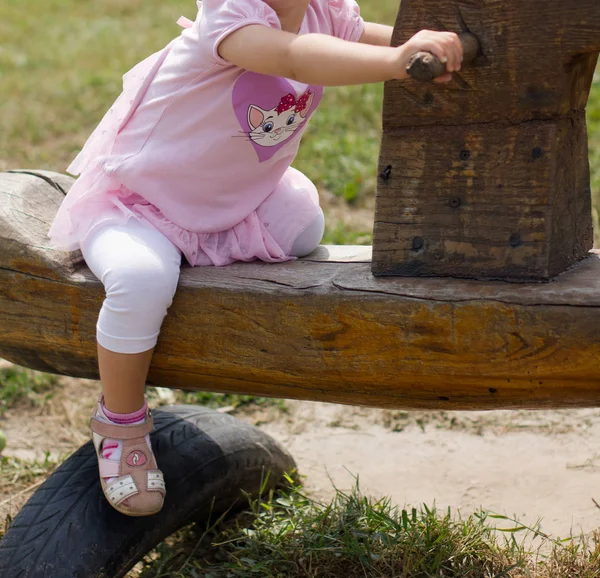 Little Girl Riding Wooden Swing — Stock Photo, Image