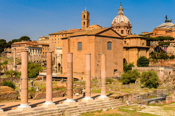 ROME, ITALY - MAY 7, 2016: Roman Forum, a rectangular forum surrounded by the ruins of several important ancient government buildings at the center of the city of Rome.