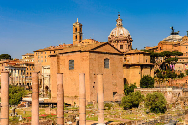 ROME, ITALY - MAY 7, 2016: Roman Forum, a rectangular forum surrounded by the ruins of several important ancient government buildings at the center of the city of Rome.