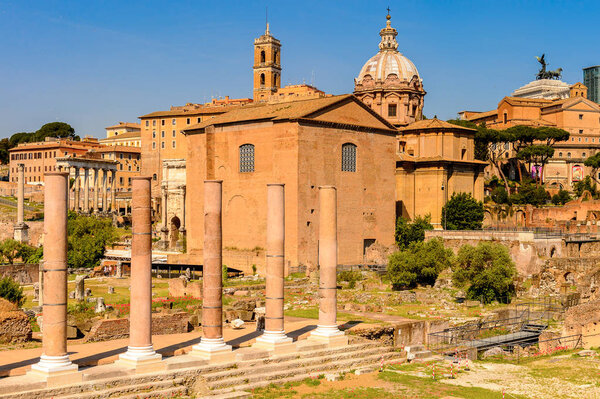 ROME, ITALY - MAY 7, 2016: Roman Forum, a rectangular forum surrounded by the ruins of several important ancient government buildings at the center of the city of Rome.