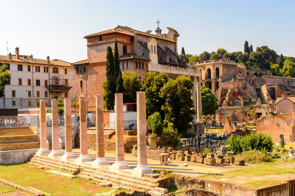 ROME, ITALY - MAY 7, 2016: Roman Forum, a rectangular forum surrounded by the ruins of several important ancient government buildings at the center of the city of Rome.