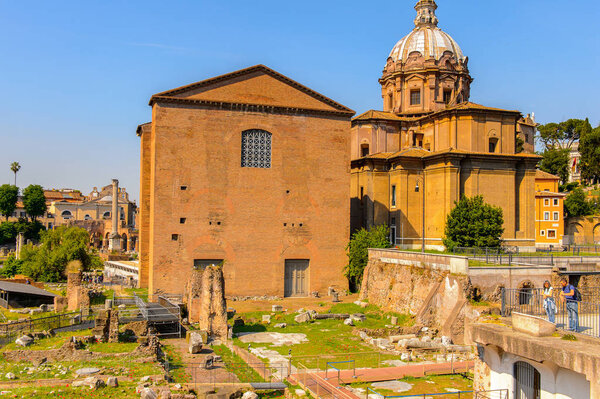 ROME, ITALY - MAY 7, 2016: Roman Forum, a rectangular forum surrounded by the ruins of several important ancient government buildings at the center of the city of Rome.