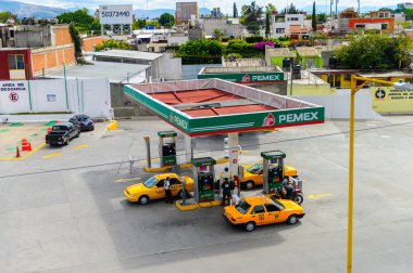 OAXACA, MEXICO - OCT 31, 2016: Aerial view of the Pemex gazoline station of Oaxaca de Juarez, Mexico. The name of the town is derived from the Nahuatl name Huaxyacac clipart