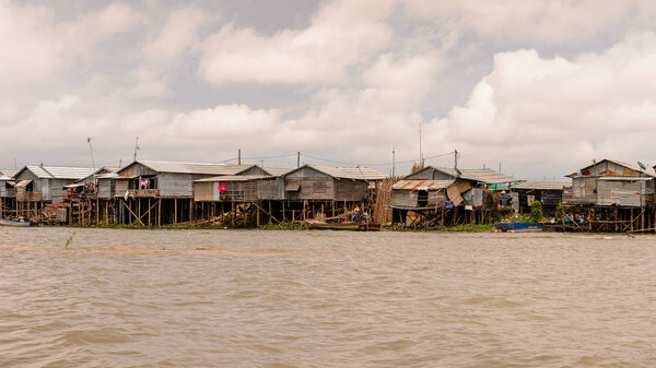 LAKE TONLE SAP, COMBODIA - SEP 28, 2014: Houses on the Tonle Sap. Lake Tonle Sap is the largest freshwater lake in Southeast Asia, a UNESCO biosphere since 1997