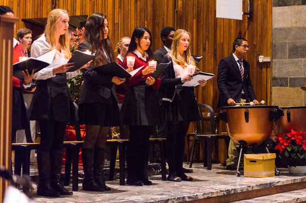 LUGANO, SWITZERLAND - DEC 6, 2015: Unidentified children sing a Christmas song in the church. The first known Christmas hymns appeared in the fourth century Rome