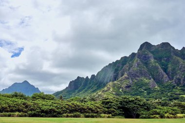 A grand view of the mountains of Kualoa Regional Beach Park at O'ahu, Hawaii, USA. clipart