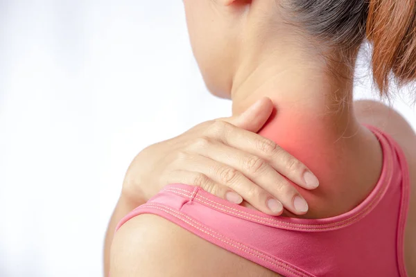 woman pain at trapezius muscle and holding right hand on muscle, swelling and inflammation of left rotator cuff muscle