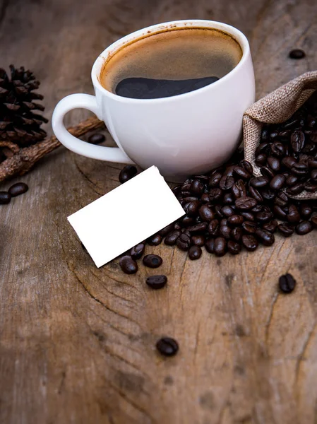 Taza Café Con Grano Café Sobre Fondo Madera Papel Blanco — Foto de Stock