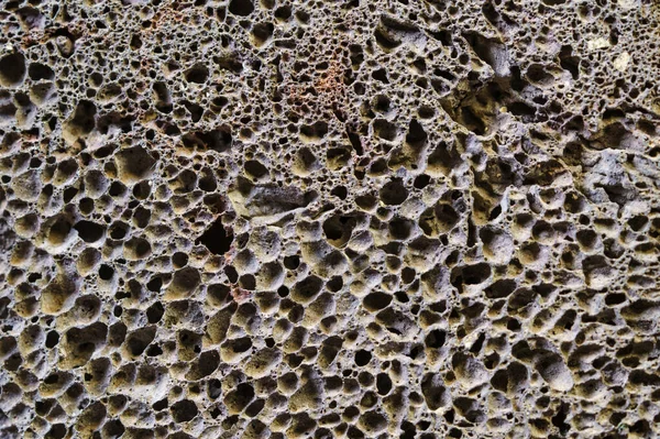 Gros plan sur la texture naturelle de pierre ponce. Fond abstrait de pierre ponce poreuse. — Photo