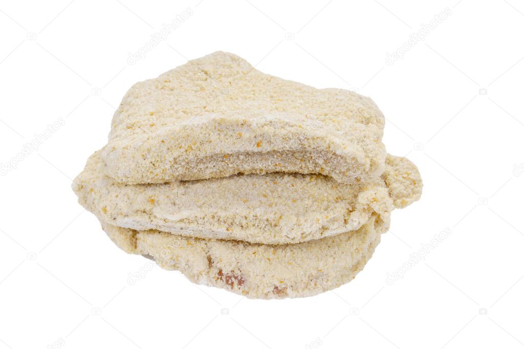 Raw turkey schnitzel in breadcrumbs with spice isolated on white