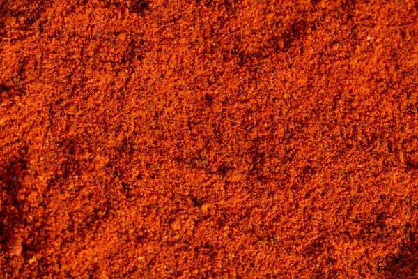Пала сушений подрібнений гарячий червоний перець, фон текстури паприки — стокове фото