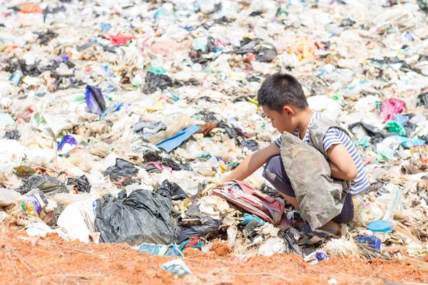 Children are junk to keep going to sell because of poverty, the concept of pollution and the environment,World Environment Day