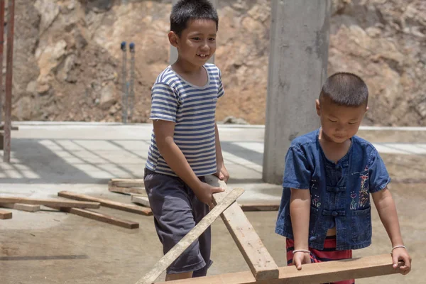 Two children were forced to work on construction because of poverty. Violence children and trafficking concept,Anti-child labor, Rights Day on December 10.