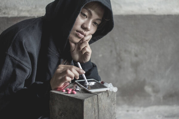 Young woman with drug addiction , The concept of crime and drug addiction. 26 June, International Day Against Drug Abuse and Illicit Trafficking